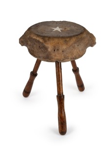 A vintage whalebone vertebrae stool inlaid with whalebone star and resting on turned blackwood legs, 20th century, ​​​​​​​42cm high.