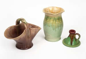 REMUED pink and green glazed pottery candle holder; together with a green glazed pottery vase and a basket vase, (3 items), the largest 18cm high.