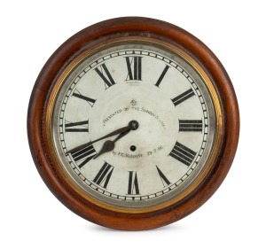 An antique cedar cased dial clock with an American Ansonia time only movement with enamel dial inscribed "PRESENTED TO THE SUNDAY SCHOOL by F.C. RIDOUTT, 29/7/1916", ​​​​​​​12" dial, 40cm diameter overall.