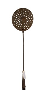 An antique trypot skimmer, copper and iron with wooden handle, purported to have come from Castle Rock Whaling Station near Busselton, Western Australian, 19th century. Note: Handle replaced. 206cm overall.
