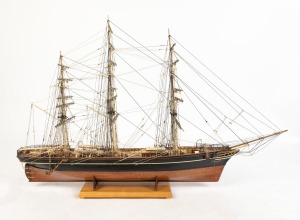 CUTTY SARK hand-built model on stand of the famed clipper ship, circa 2000, 74cm high, 116cm long overall.