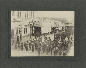 Victorian Rangers and Band High Street, Maryborough, c.1890s silver gelatin photograph, titled in negative lower left, signed "D.F.Plucki, Maryborough" in ink on backing below image, laid down on original backing, 11x15cm.