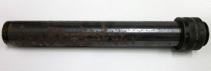 WW2 OPTICAL EQUIPMENT: Australian made telescope sighting in original metal casing. Markings on telescope read, "telescope sighting No. 141 (AUST) MK1 JWH/V Reg No. 327 1945". Good condition