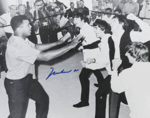 MUHAMMAD ALI & THE BEATLES, photograph of Ali clowning around with The Beatles, signed "Muhammad Ali", size 51x40cm. With CoA.