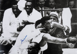 MUHAMMAD ALI, signed photograph from the Muhammad Ali vs Sonny Liston fight, February 25th 1964, size 51x36cm. With 'Online Authentics' No.12481.