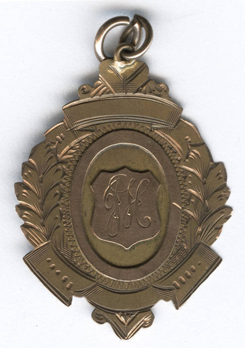 CRICKET MEDAL, 9ct gold fob/medal with initials "JH" on front, engraved on reverse "W.P.M.C.C., Awarded To, J.Heffernan, Best All Round, Season 1925-26". Weight 4.85 grams.