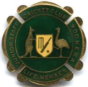 CRICKET BADGE, 9ct gold & enamel badge with "Junior Staff, Cricket Club, Woomera, Life Member" on front, engraved on reverse "J.Nelson, 1964-65". Weight 14.06 grams.