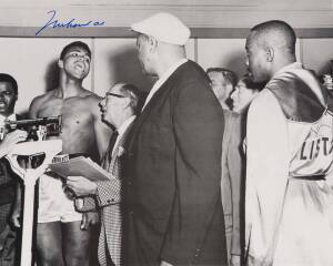 MUHAMMAD ALI, signed b/w photograph of Ali at weigh-in with Sonny Liston, size 51x41cm. 