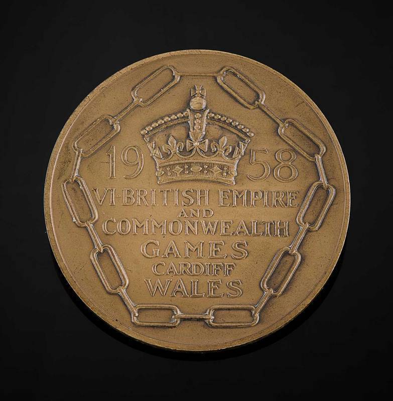 1958 BRITISH COMMONWEALTH GAMES IN CARDIFF, Participation Medal "1958 VI.British Empire and Commonwealth Games, Cardiff, Wales", 55mm diameter, engraved on rim "Robert Kotei". [Major General Robert Kotei (1935-79) was a soldier, politician and track and f