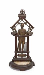 CRICKET UMBRELLA STAND, c1890, painted cast iron with main support a cricketer leaning on a bat before 3 stumps, 83cm tall.