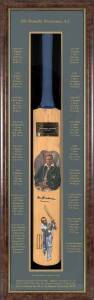 DON BRADMAN, nice signature on full size Cricket Bat decorated with hand-painted portraits of Don Bradman, window mounted with Bradman's record printed on mount, framed & glazed, overall 34x109cm. VG condition.