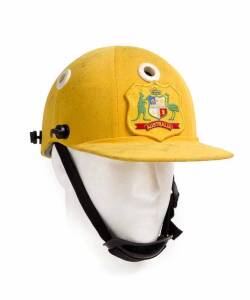 TIM ZOEHRER'S AUSTRALIAN ONE-DAY HELMET, yellow with embroidered Australian Coat-of-Arms badge on front, signed inside by Tim Zoehrer, no grill. Fair/Good match-worn condition. [Tim Zoehrer played 10 Tests & 22 ODIs 1985-94].