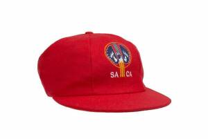 SOUTH AUSTRALIA CRICKET CAP, baggy red with embroidered "SACA" logo on front, player unknown. Good condition.