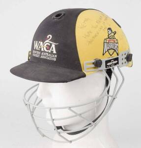 RYAN CAMPBELL'S WESTERN AUSTRALIA CRICKET HELMET, black & yellow, with embroidered "WACA/ Western Australia/ Cricket Association" logo on front, signed & endorsed on side of helmet by Ryan Campbell, with protective grill. Good match-used condition. [Ryan 