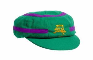 DENNIS LILLEE'S ACB CHAIRMAN'S XI CAP, from the 1995 Lilac Hill match - ACB Chairman's XI v Pakistan (the 1st match of the 1995-96 Pakistan tour of Australia), green with lilac bands, with embroidered Lilac Hill logo on front, signed inside by Dennis Lill