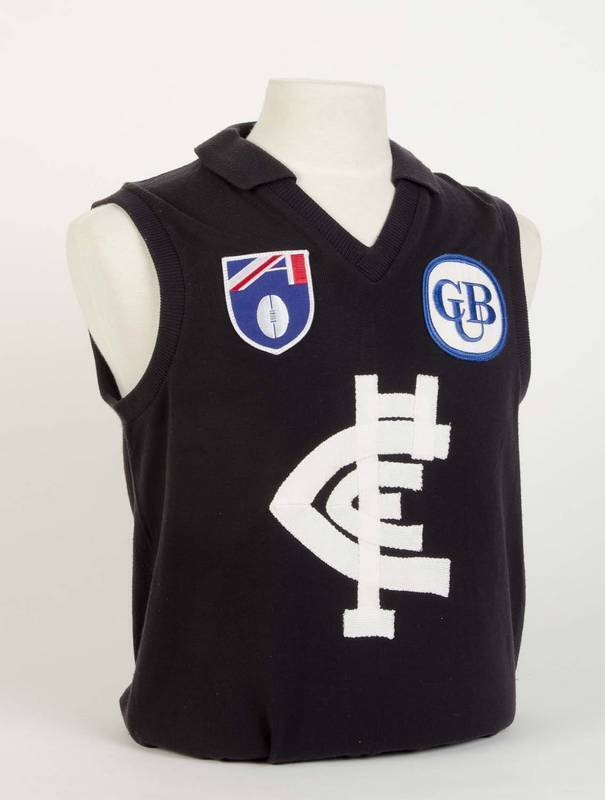 CARLTON: 1990-94 Carlton home jumper, number 13 Mil Hanna, signed on number. Rare player issue jumper, CFC logo is made of several pieces that are individually sewn on, unlike the store replicas which had a felt iron on transfer logo.