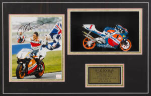 MICK DOOHAN, display comprising signed photograph, window mounted with diecast model bike, framed & glazed, overall 74x53cm. With CoA.