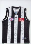 COLLINGWOOD: Collingwood football jumper signed by 2002 Grand Final team, window mounted, framed & glazed, overall 67x90cm.