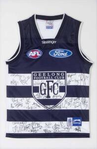 GEELONG: Geelong football jumper signed by 2009 Premiership team, window mounted, framed & glazed, overall 76x106cm.