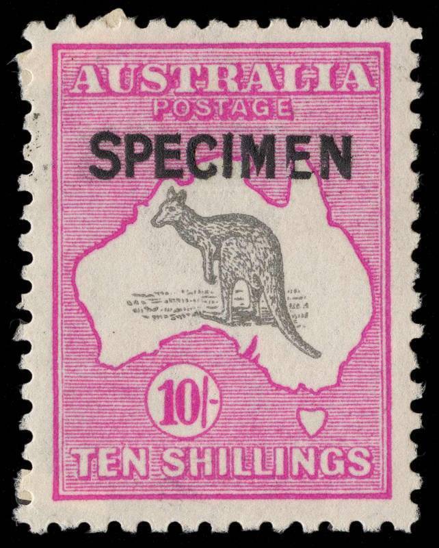 10/- Grey & Deep Aniline Pink, overprinted SPECIMEN, Type B, with most unusual splintered E in SPECIMEN; full gum, with P.O. re-inforcement on 2 corners. BW:48x - $600+.