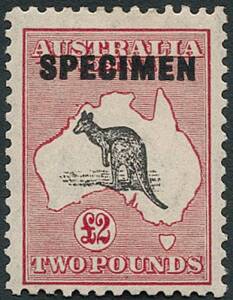 10/- Grey & Aniline Pink SPECIMEN Overprint Type D (**), plus &pound;2 Black & Rose SPECIMEN Overprint o.g.; the overprint much higher than normal and the stamp with "Broken coast in Bight" variety. Also, another &pound;2 SPECIMEN with a different "Broken coast in Bi