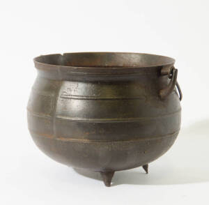 A cast iron cauldron, height 23cm, diameter 18.5cm