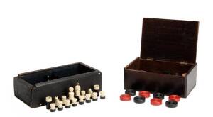 A cased wooden chess set and a wooden box containing ebonised and red lacquer checkers pieces.
