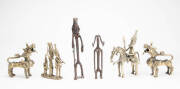 African tribal metal sculptures (4) & a pair of brass temple dog statues (possibly Tibetan). Largest 23cm high. (6 items)