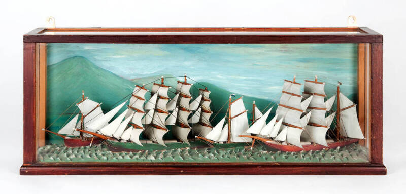 A Victorian painted diorama, English 19th century;  four ships under sail under glass; 27cm high, 57cm wide.