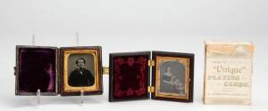 AMBROTYPES: Two mid 19th century portrait photographs in bi-fold cases; plus antique playing cards. (3 items)