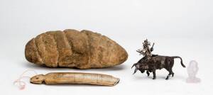 Various: Oceanic stone carving; rock crystal owl ornament, Dayak bone carving; silver bull with miniature swords. (4 items)