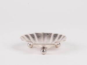 A silver butter dish, by Dee of London c1869, of shell form on circular feet. 11cm length; 118gms