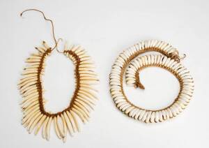 A tooth necklace and shell necklace, 20th century.