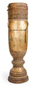 A Filipino Pedestal Drum, Mindanao Island, 20th century; used for weddings and festive celebrations. 237.5cm high