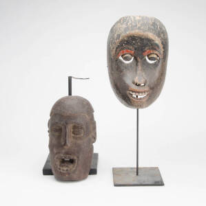 Two Wooden Masks,&nbsp;Dyak, Indonesia; Asmat, Papua New Guinea (mid 20th century), carved wood and pigments, 22cm; 22.5cm (2)