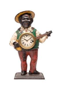 American cast iron Negro banjo player clock, late 19th century. 40cm