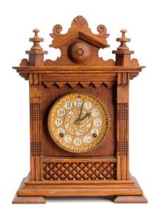 Ansonia oak cased American cottage clock, late 19th century. 38cm.