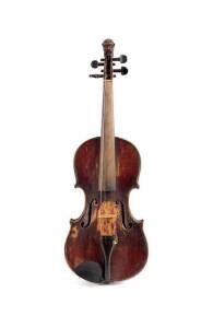 VIOLIN: German trade late 19th century most likely from Saxony with ornate carved lion scroll in vintage case.
