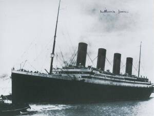 RMS TITANIC, group with photograph of the Titanic signed by the last survivor Millvina Dean; two pieces of coal recovered from the wreck; book "Titanic & Her Sisters Olympic & Britannic" by McCluskie et al [London, 1999]; reproduced souvenirs.