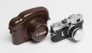 CANON CAMERA CO. (Japan): Canon screw mount camera Model VI-T SN 603048 with 50mm f1.8 SN 238696. Canon lens cap and maker's leather ERC. A tiny wrinkle to the blinds otherwise a very nearly mint example. A beautiful camera.