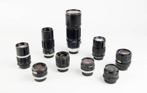 MINOLTA (Japan): Minolta manual focus lenses (MC/MD). A group of (9) lenses comprising: MD 28mm f2.8, MC 28mm f2.5 and f3.5, MC 55mm f1.7, MC 135mm f2.8 (2), MC 200mm f4.5, MC 30cm f4.5 and MD zoom 35-70 f3.5. Nearly all lenses with caps and a case.