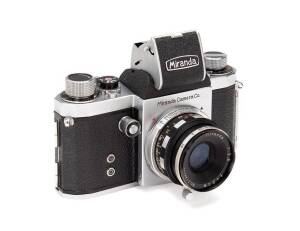 MIRANDA CAMERA CO.LTD. (Japan): Miranda ST 35mm camera. The camera SN 559776 with Miranda 5cm f2.8 SN T148165, waist level finder, accessory leather pouch with lens hood, Miranda Series VI adaptor and generic filter, the camera in maker's leather ERC. A l