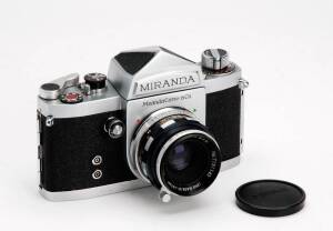 MIRANDA CAMERA CO.LTD. (Japan): Miranda DR 35mm camera. The camera SN 656686 with Miranda 5cm f2.8 SN T151143 and lens cap in maker's ERC together with a DR camera manual.