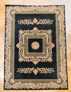 RUG: Machine made European style rug in black and olive green. 225 x 160cm