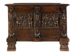 A heavily carved oak coffer, incorporating 16th century elements