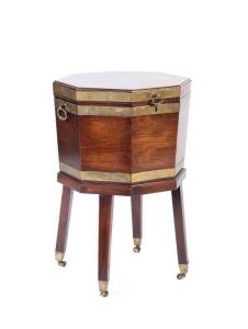 CELLARETTE: English 18th century mahogany octagonal brass bound wine cooler resting on square form tapering legs, c1770s. Height 72cm