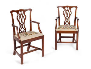 A pair of Georgian mahogany Hepplewhite carver chairs with tapestry seats.