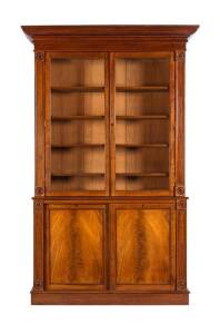 BOOKCASE: An impressive English mahogany library bookcase with sliding lower doors. Regency period c1820. Height 268cm, width 150cm, depth 42cm