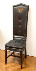Pair of highback leather chairs from the "HONG KONG CLUB" emblazoned with crests. Early 20th century