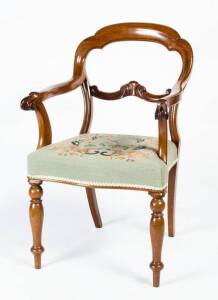 CARVER CHAIR: Early 20th Century balloon back reproduction carver chair with floral tapestry seat.